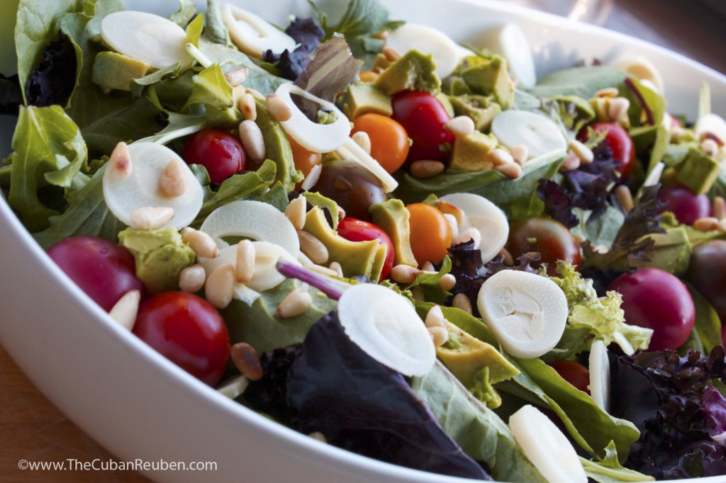 Pre-dressing, my salad included spring mix lettuce, sliced hearts of palm, cherry tomatoes, toasted pine nuts, and chunks of fresh avocado.