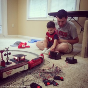 Uncle Ken shows Eli how to make the trains run. There may be another engineer in the family, soon!